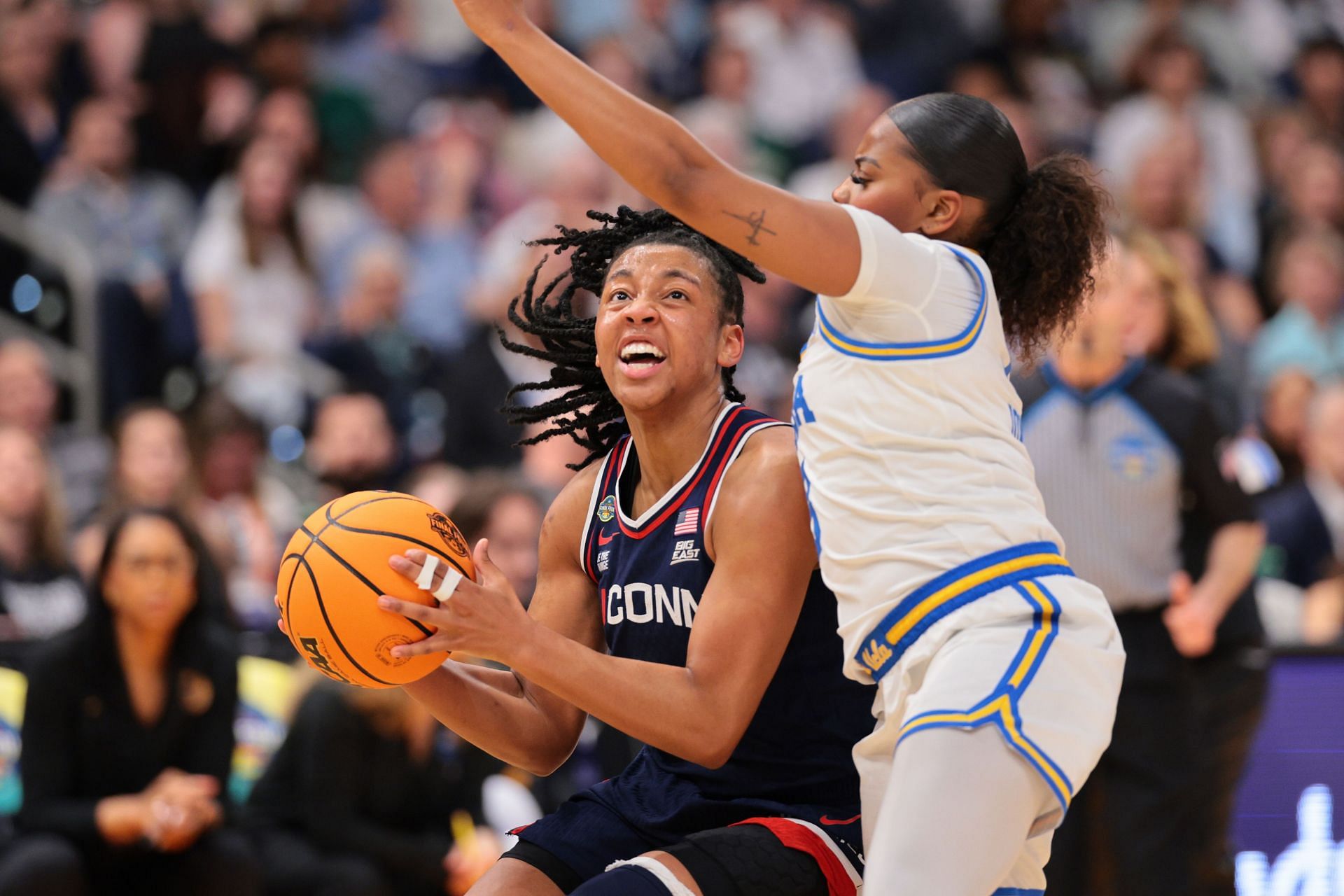 KK Arnold (#2) of the UConn Huskies looks for an open shot while guarded by Londynn Jones #3 of the UCLA Bruins during their NCAA Final Four clash at Amalie Arena on April 4, 2025 in Tampa, Florida. Photo: Getty